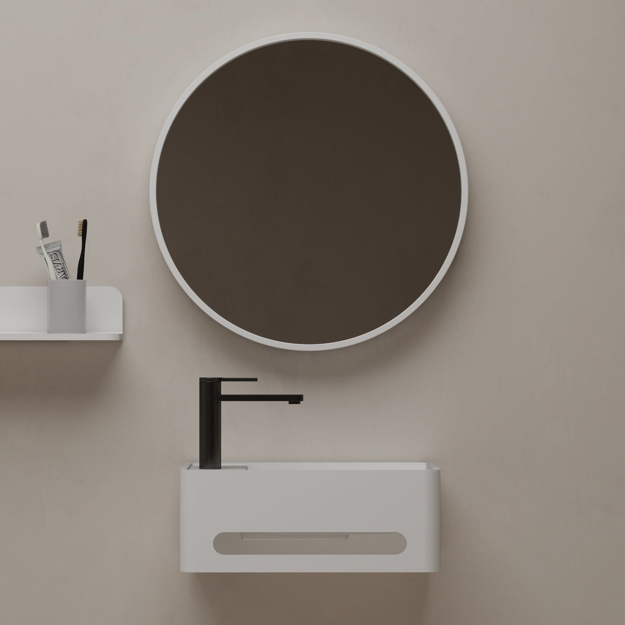 Bathroom setup with a round mirror and wall-mounted sink against a beige wall.